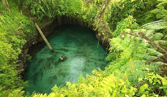 Peaking into deep To Sua waterhole, Upolu Island, Samoa