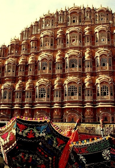 Colorful umbrellas in front of Hawa Mahal Palace in Jaipur, India